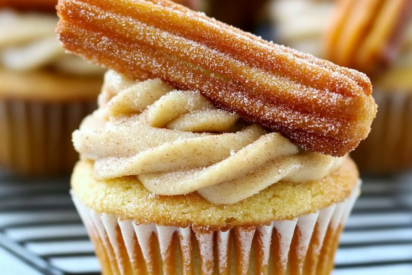 Churro cupcakes combine the beloved flavors of churros with a moist, fluffy cake. Topped with creamy frosting and a sprinkle of cinnamon sugar, they're a delightful treat for any occasion.