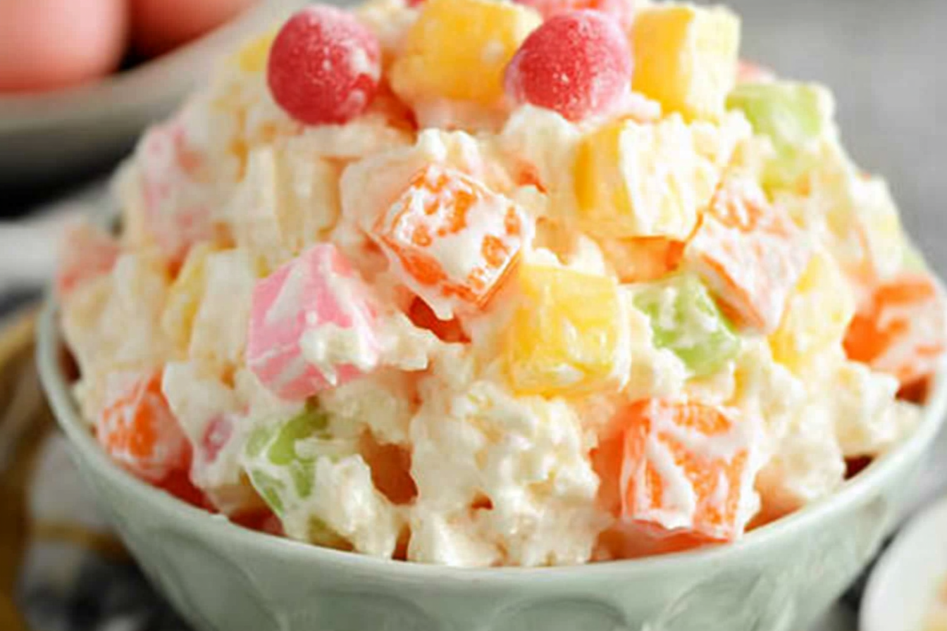 Classic Ambrosia Salad is a delightful mix of fruits, marshmallows, and a creamy dressing, making it a nostalgic favorite for gatherings and family meals.