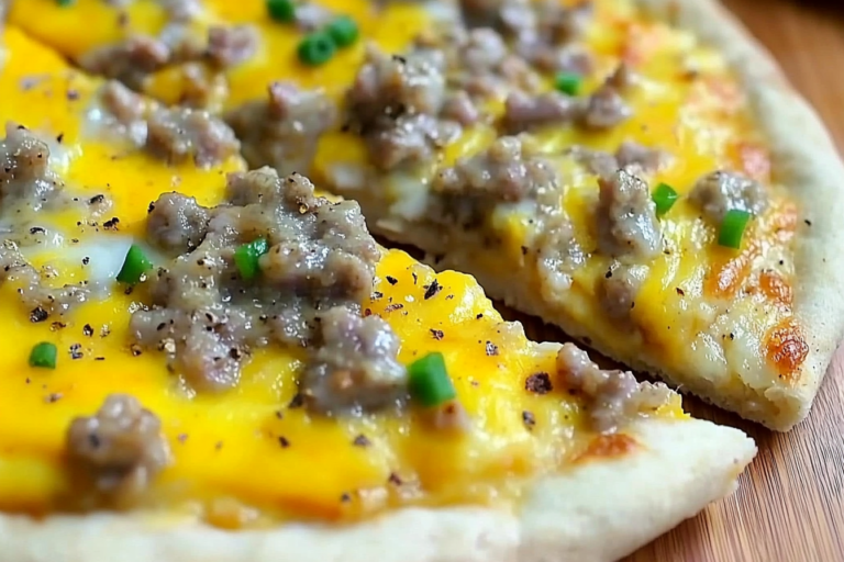 This Sausage Gravy Breakfast Pizza combines savory chicken sausage with creamy gravy and fluffy eggs for a hearty breakfast that will start your day off right.