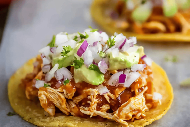 Experience the bold flavors of Mexico with these delicious Chicken Tinga Tostadas that are sure to impress.