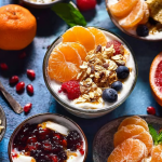 A colorful yogurt bar featuring fresh fruits, granola, and chocolate chips for yogurt toppings.