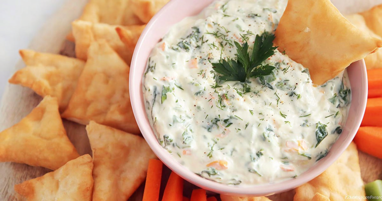 Healthy yogurt dip for veggies served with fresh colorful vegetables.