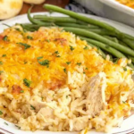 Delicious Angel Chicken and Rice Casserole served warm, garnished with fresh parsley, alongside a colorful side salad.